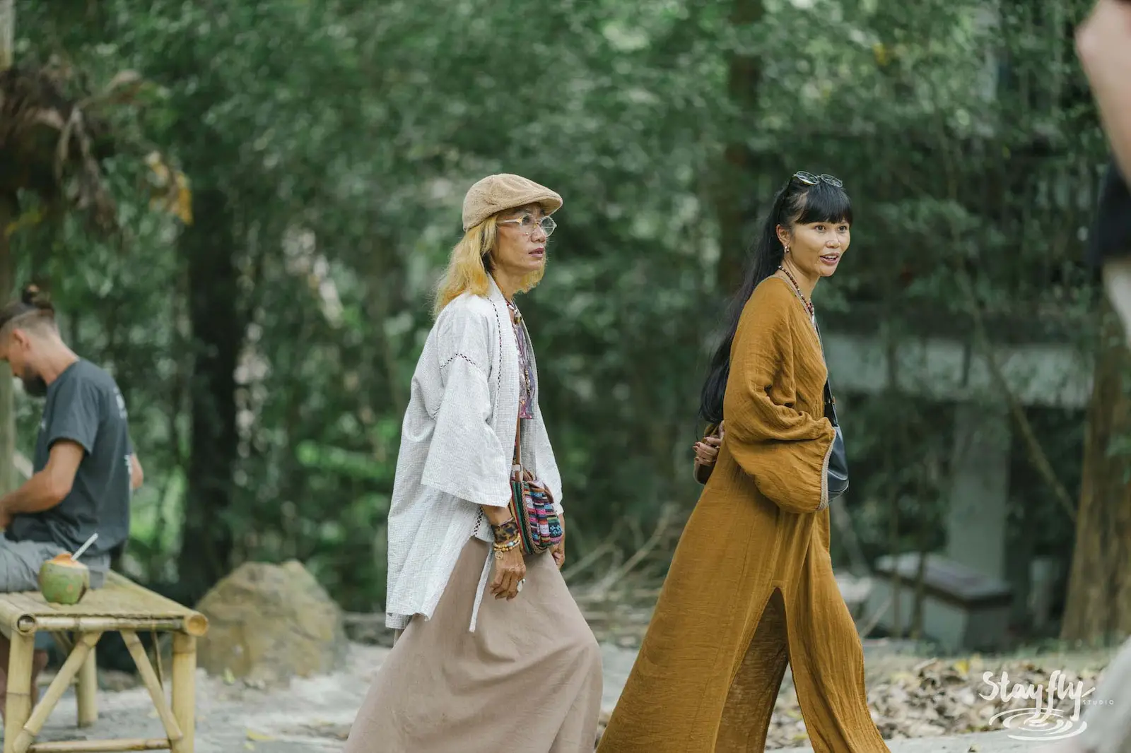Two women walking through venue grounds.
