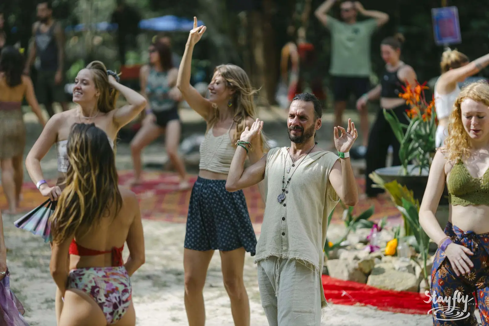 Group dancing outdoors in daylight.
