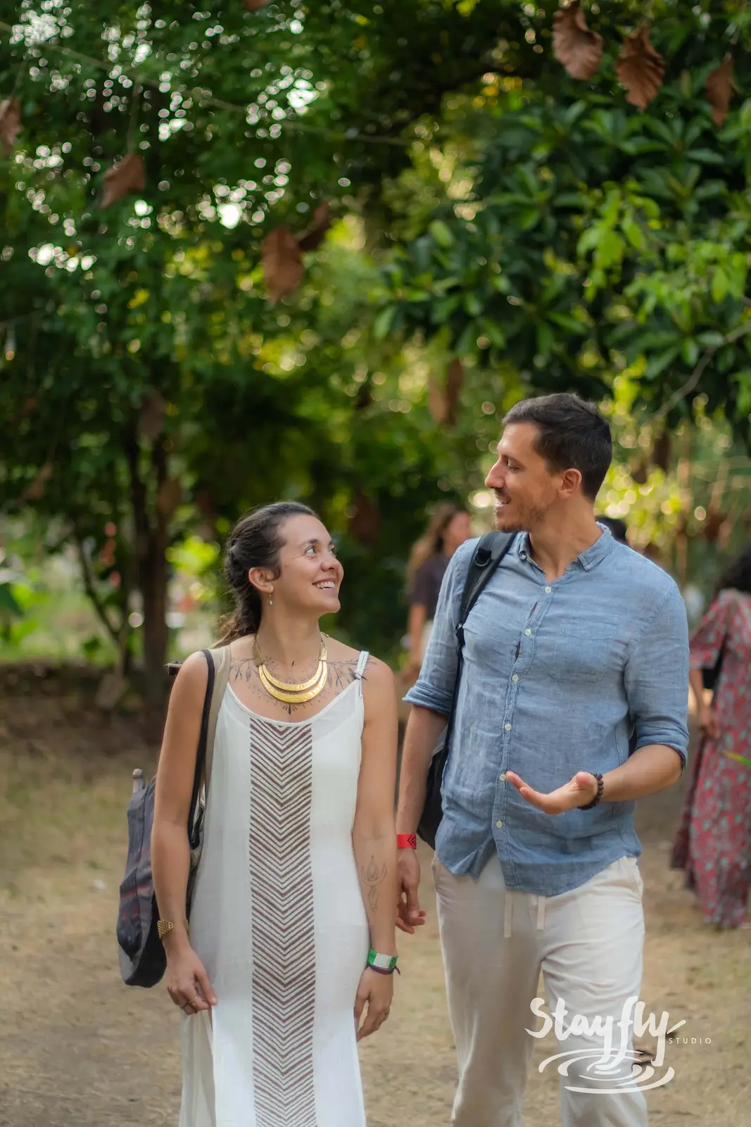 Couple walking together smiling.