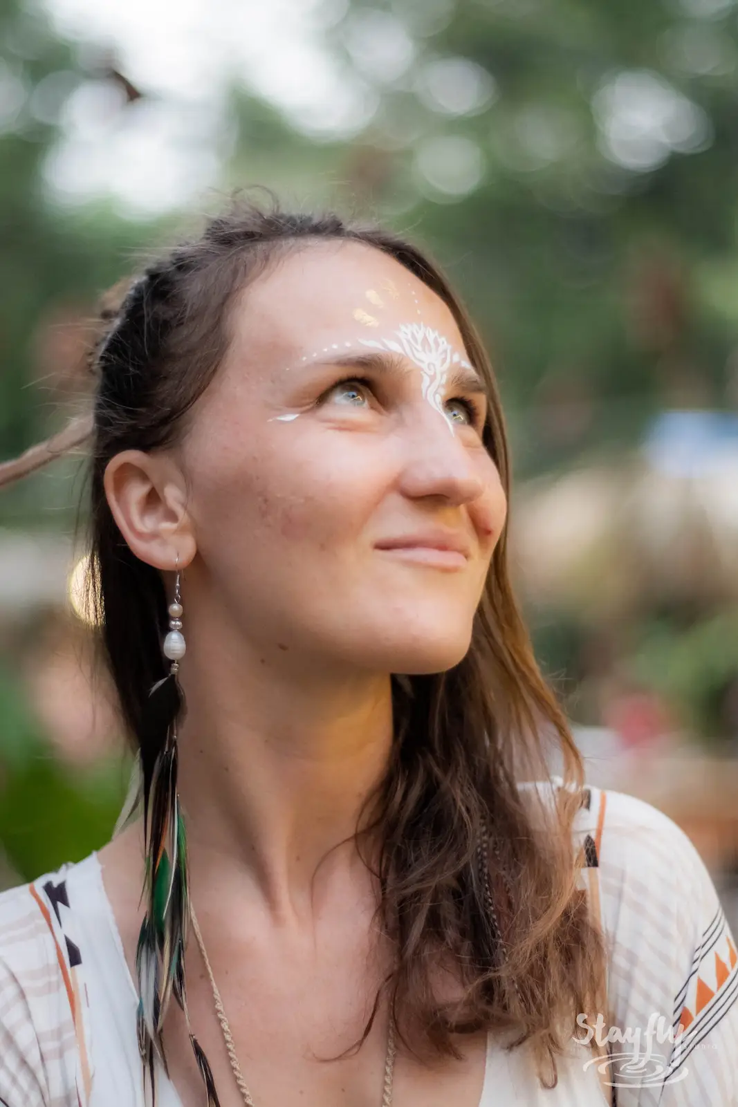 Woman portrait with face paint markings.