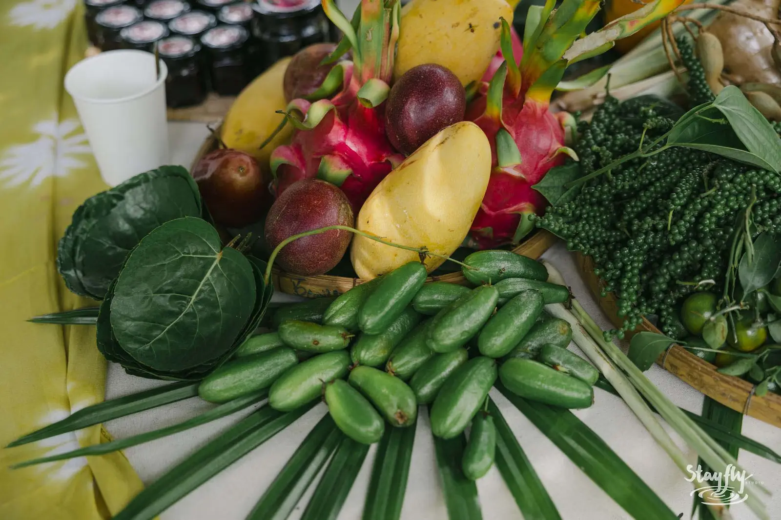 Tropical fruit and vegetable display close-up.