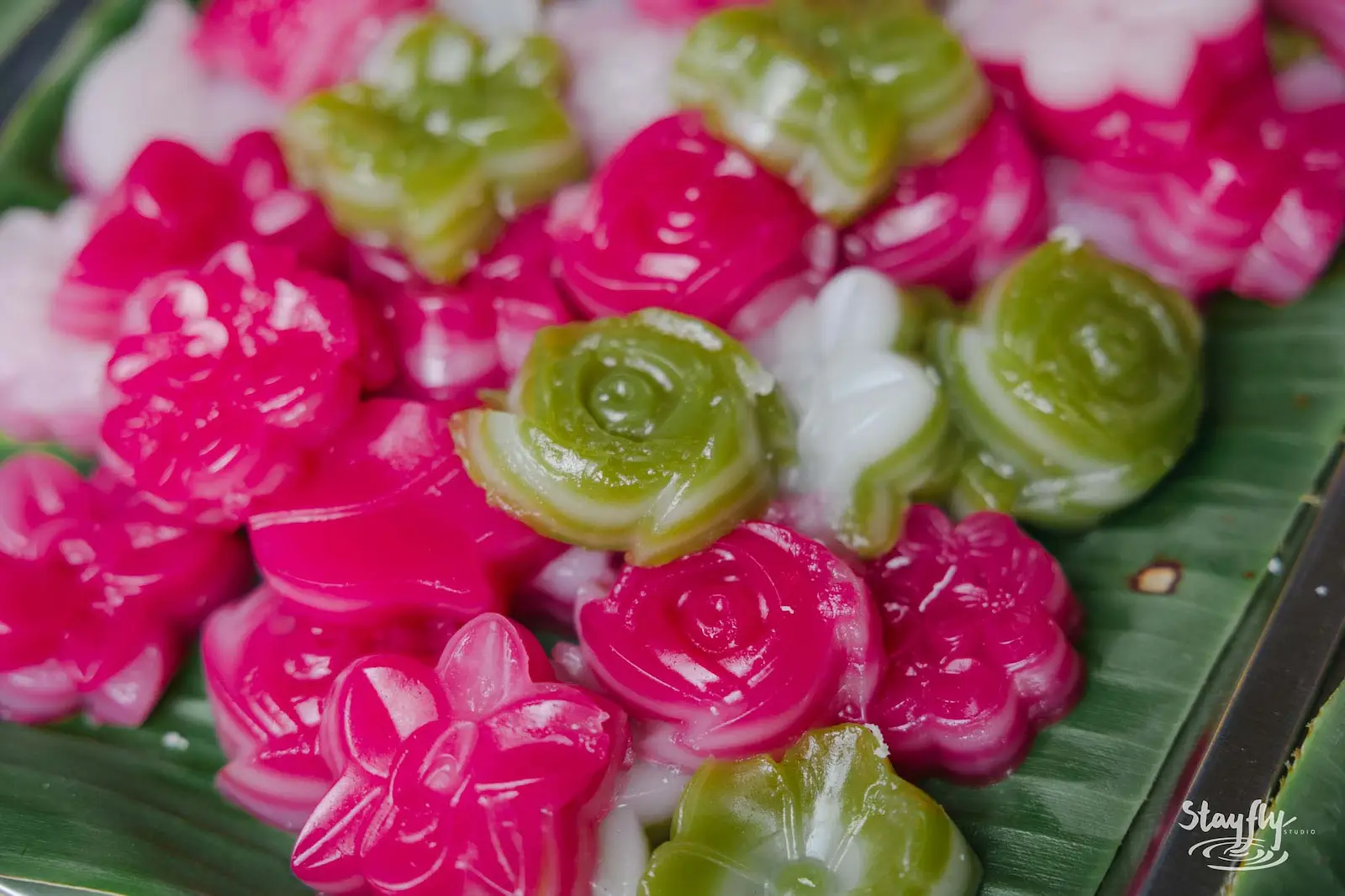 Colorful Thai sweets on banana leaf.