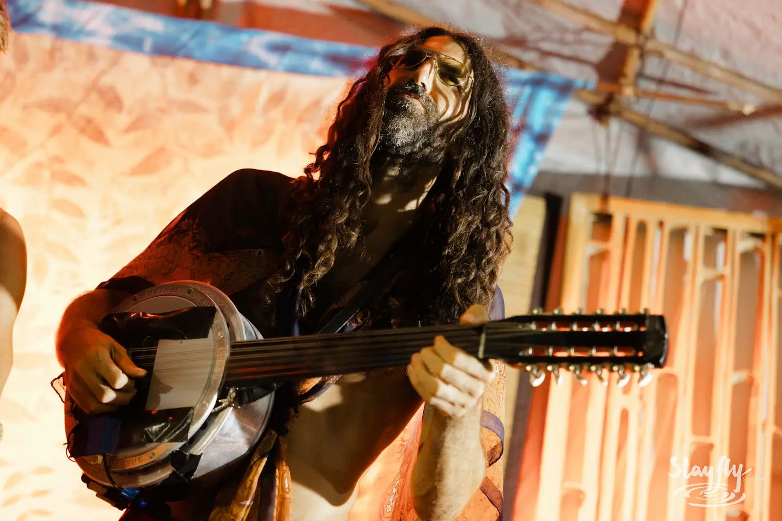Guitarist performing on stage.