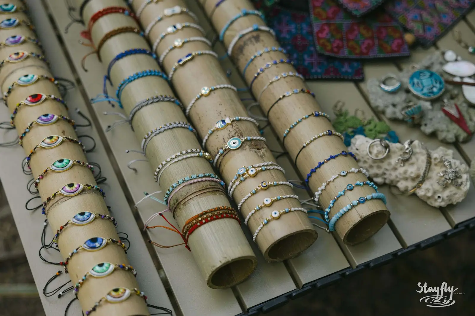 Beaded bracelets displayed at a market stall.