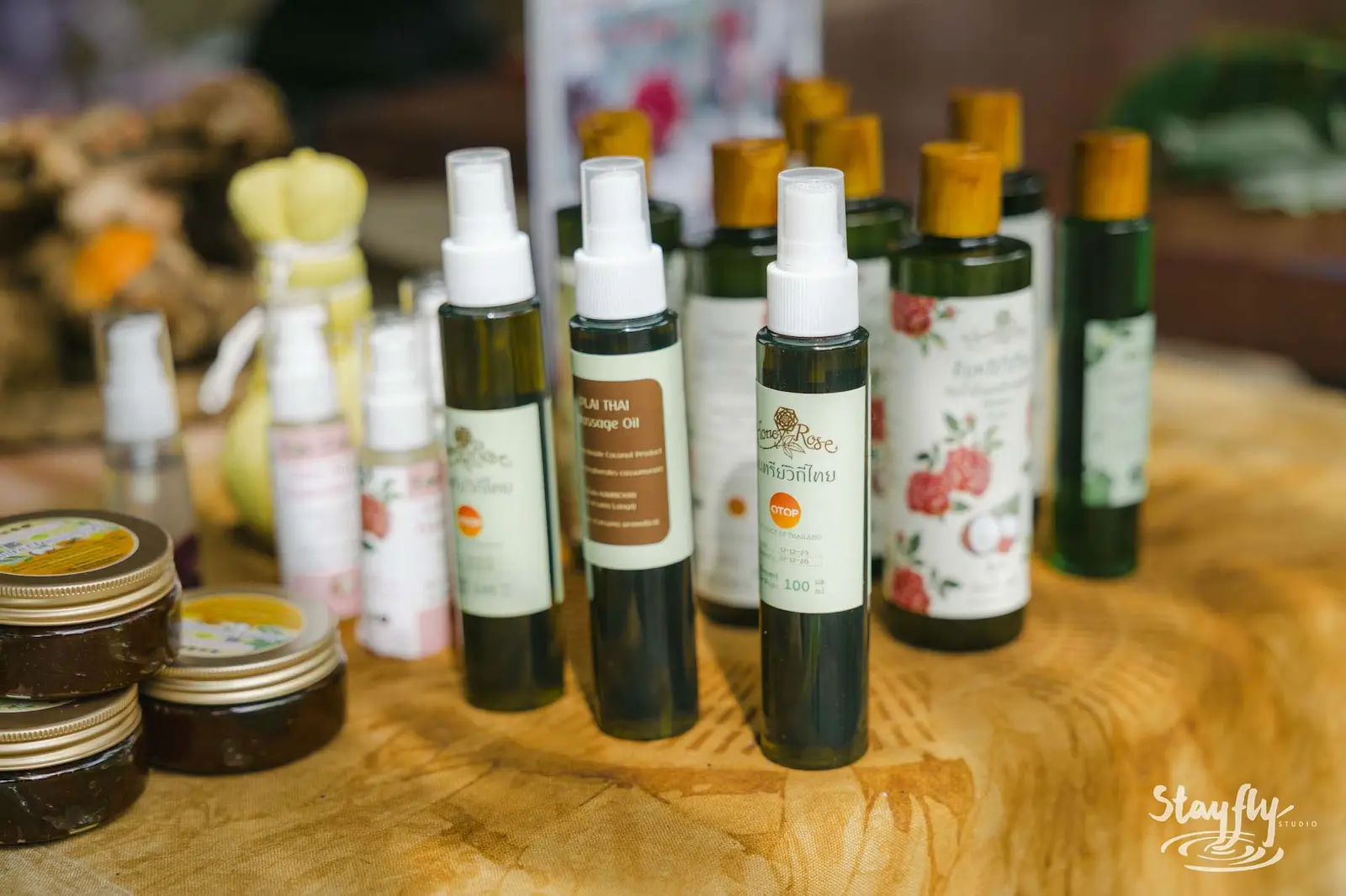 Market table with herbal oils and balms.