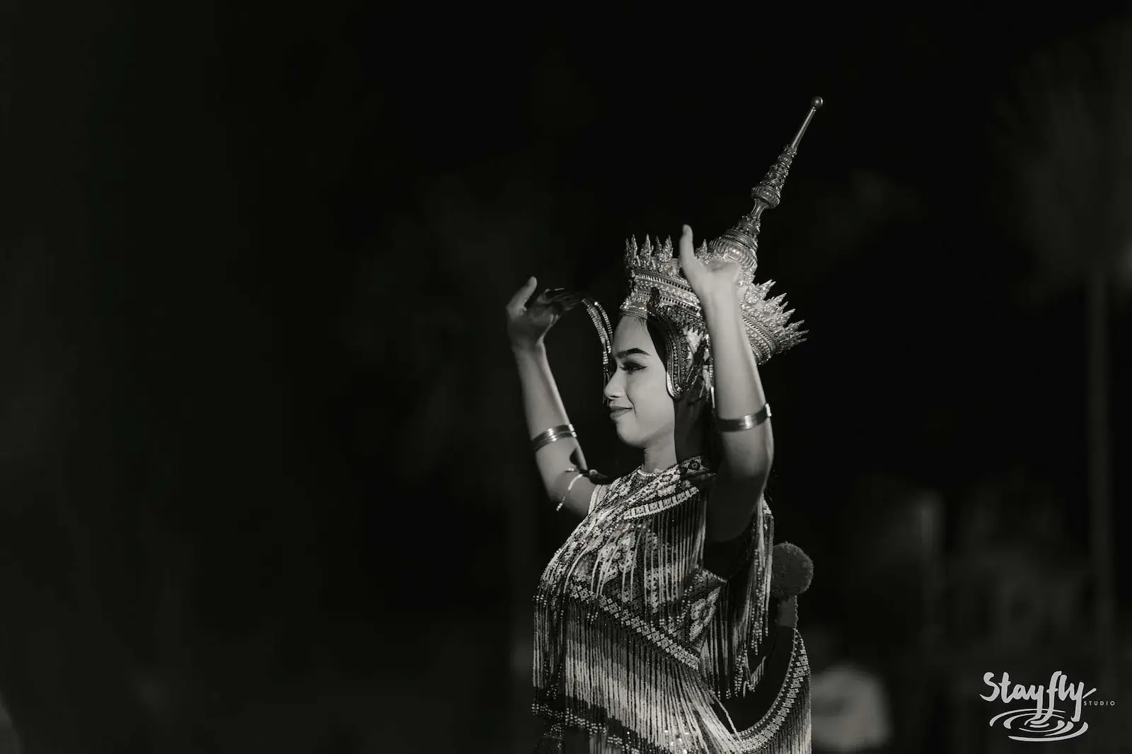 Black and white portrait of costumed dancer.