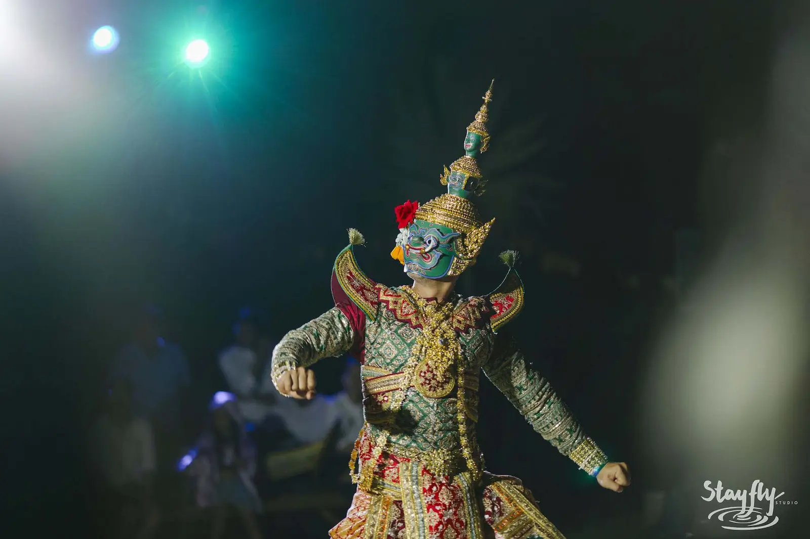 Khon performer in ornate costume mid-dance.