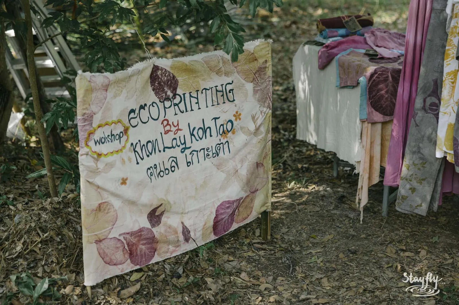 Ecoprinting workshop banner sign with fabric samples.