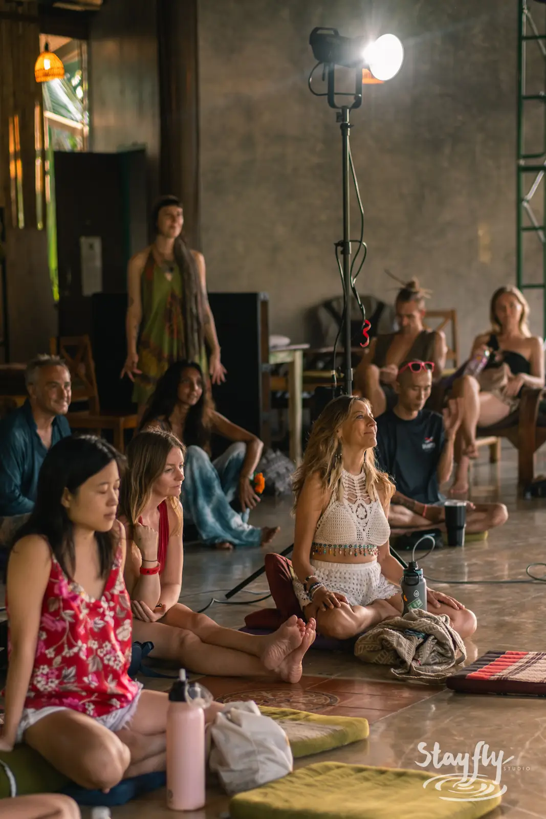 Audience seated for an outdoor talk session.