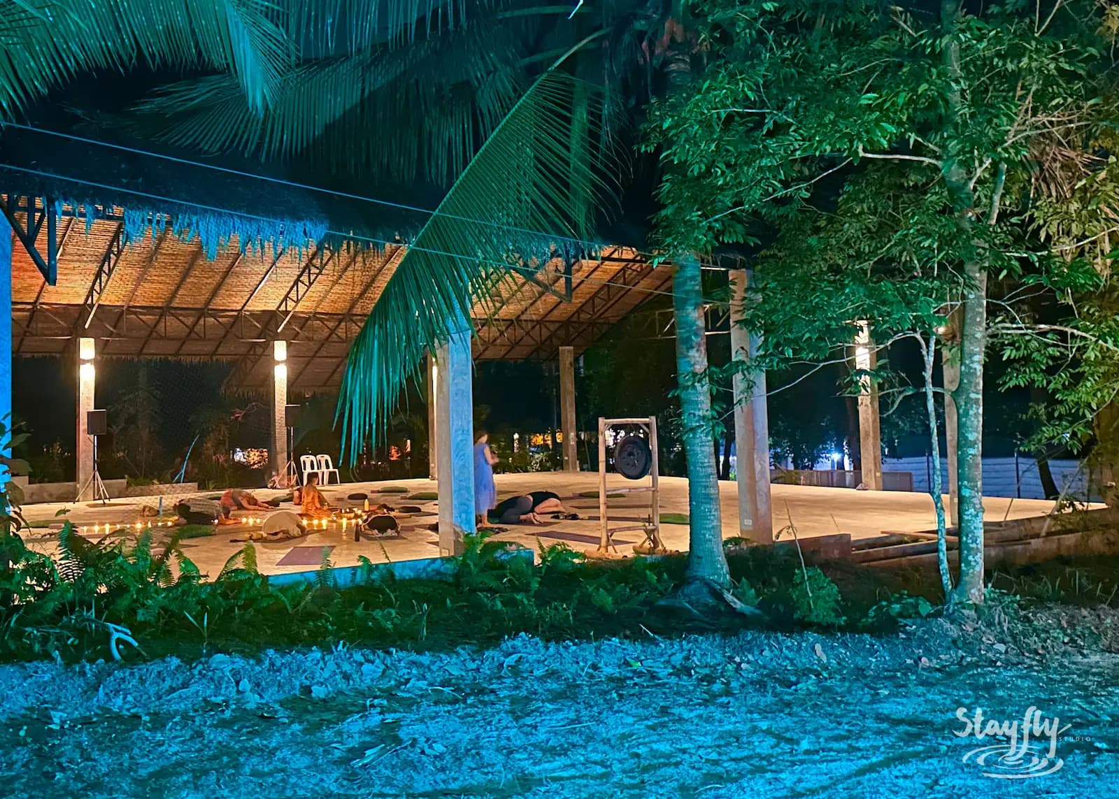 Empty open-air venue lit at night.