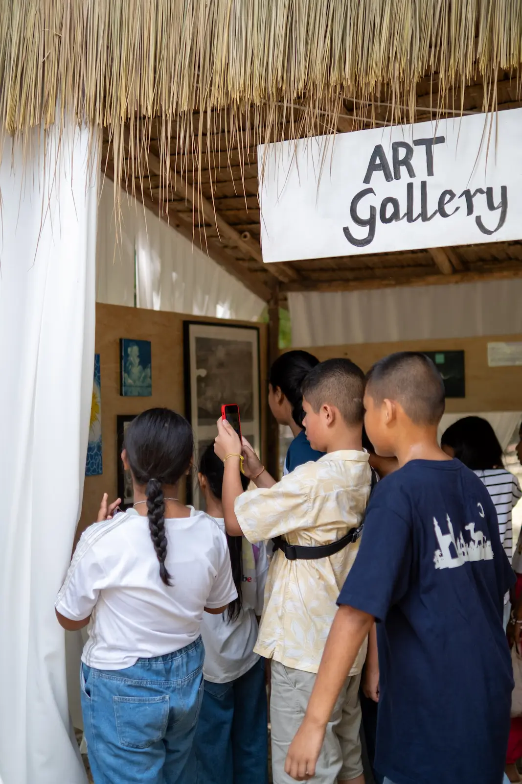 Children line up to enter Art Gallery booth.