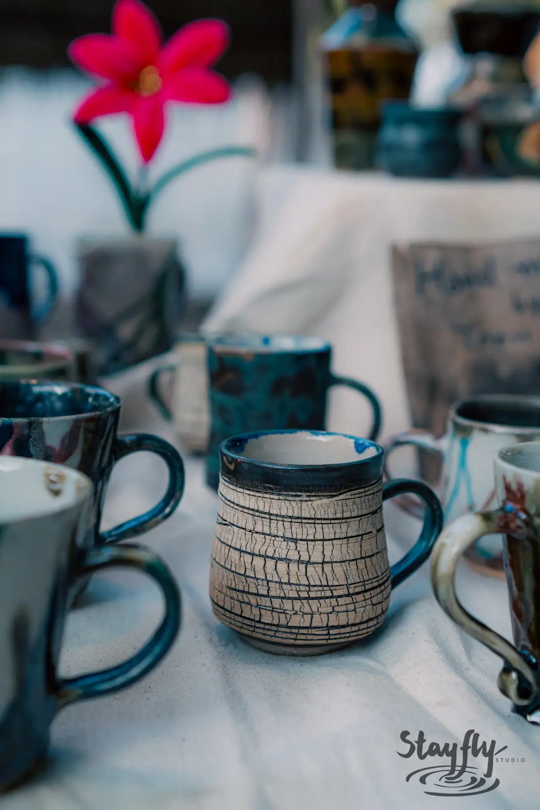 Close-up of handmade ceramic mug on table.