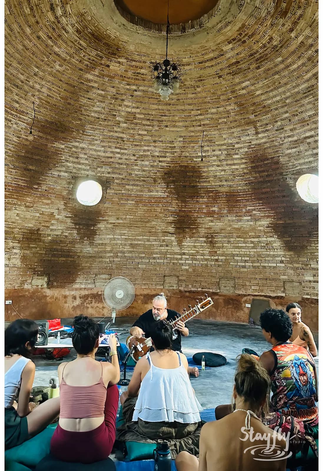 Trombone player performing inside the dome.