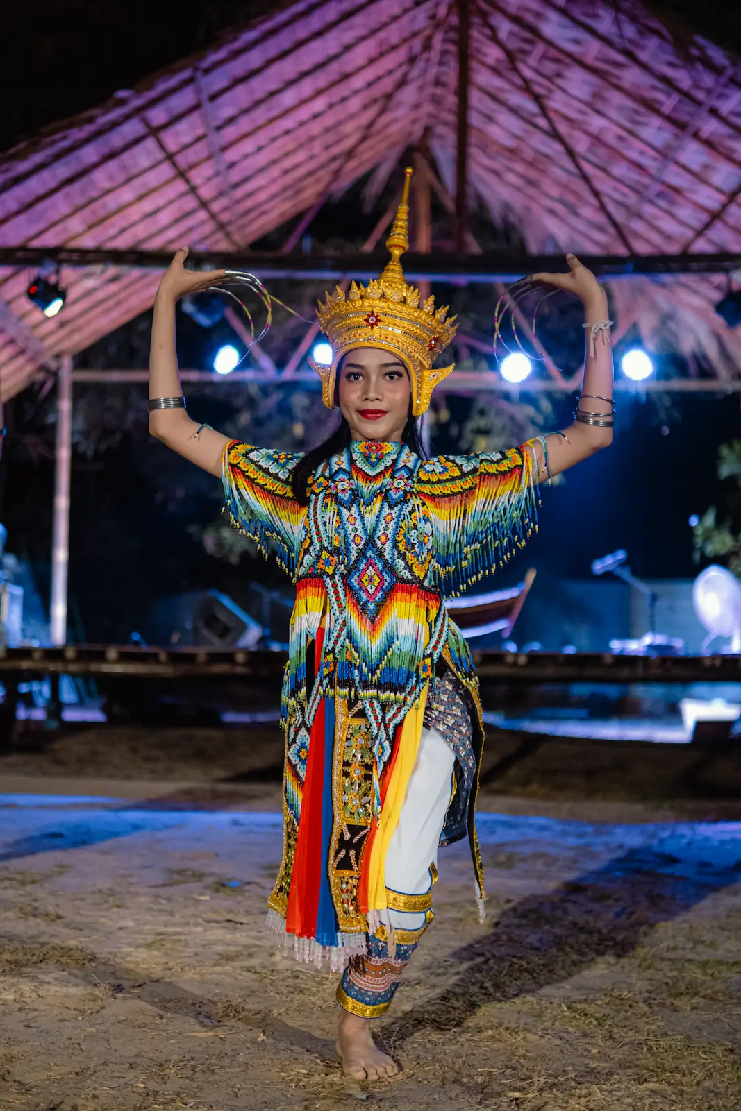 Girl dancer poses in gold crown and costume.