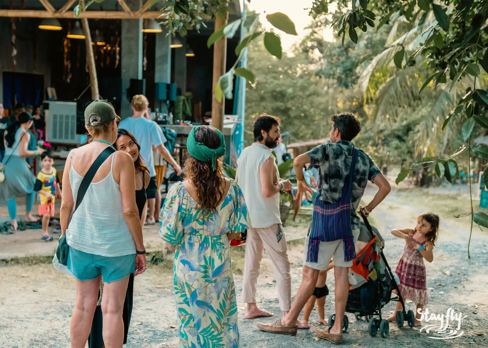 Families gathered outdoors at golden hour.
