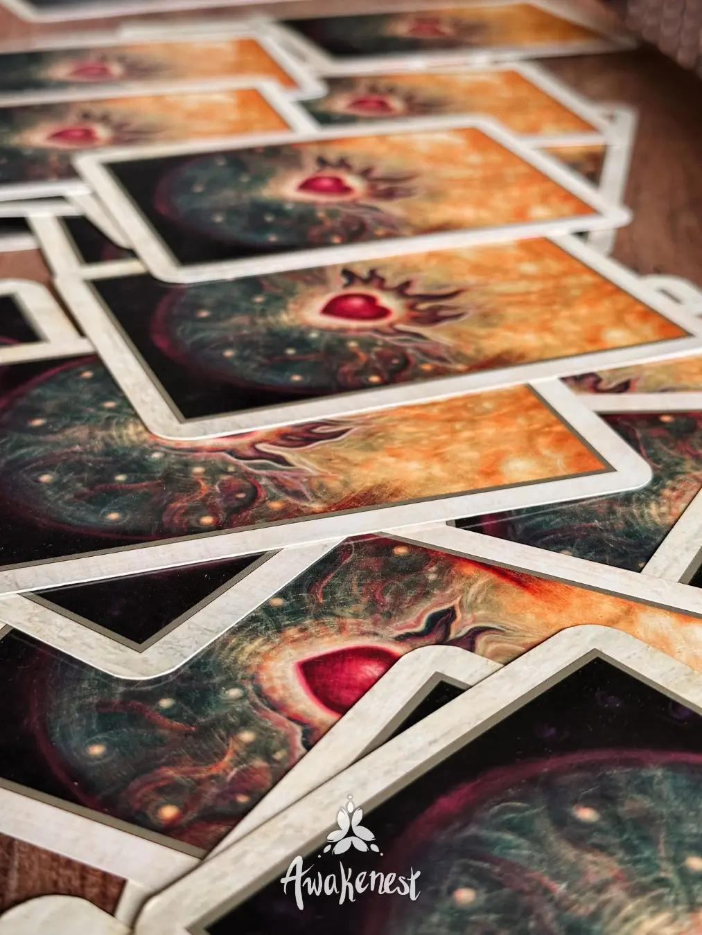 Close-up of scattered oracle cards on table.