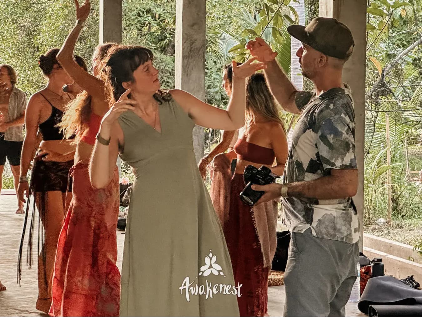 Daytime dance circle under open pavilion.