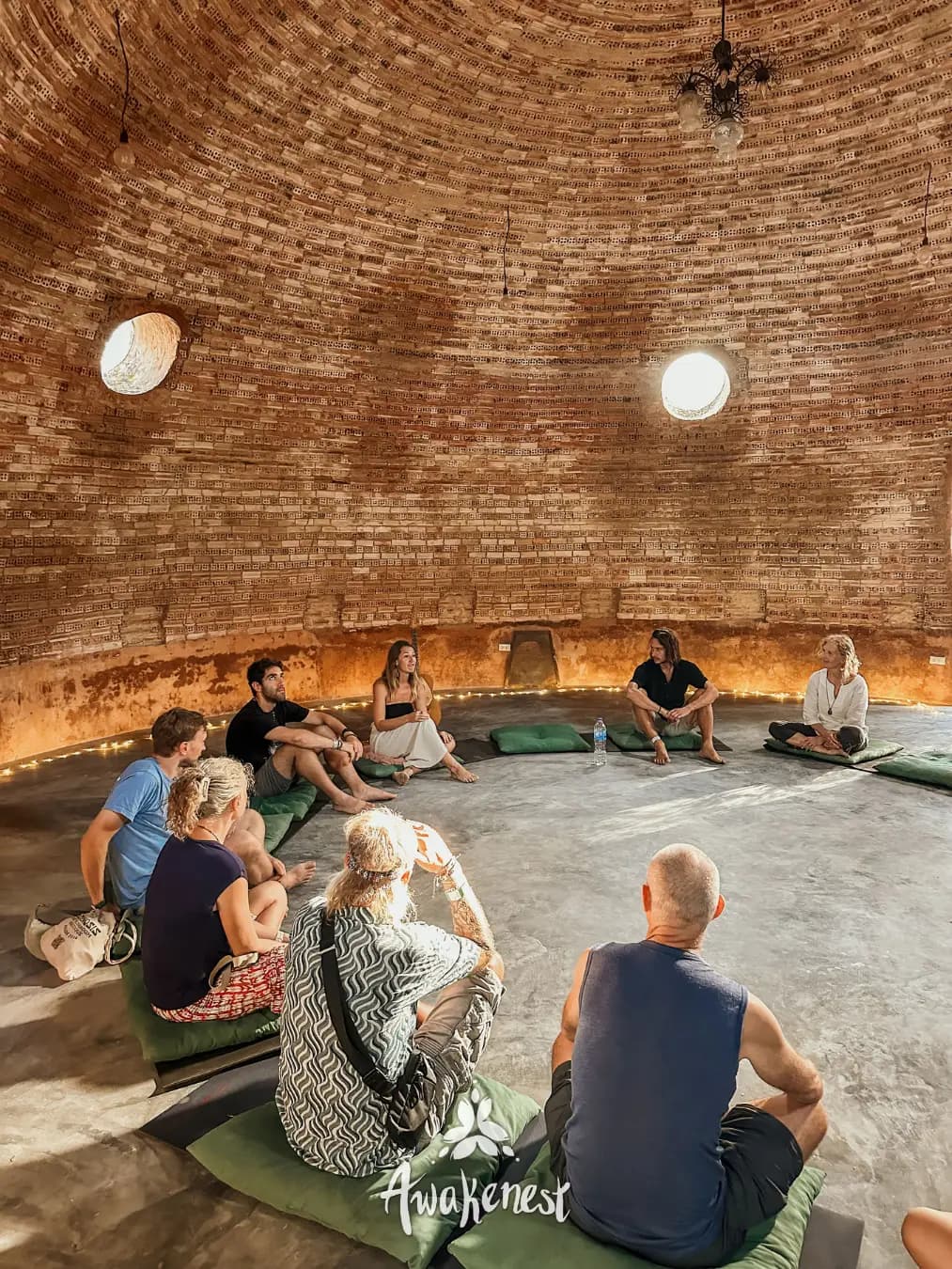 Circle seated inside round brick dome.