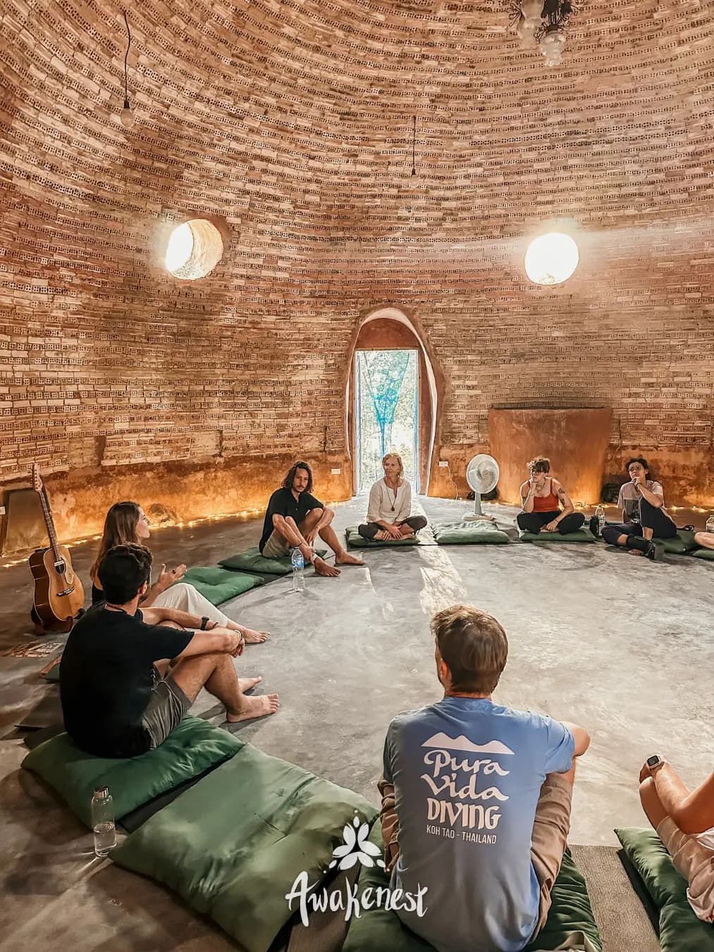 Group circle seated inside brick dome again.