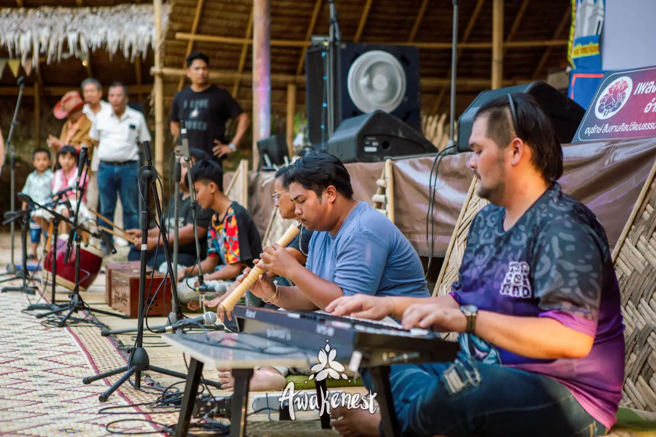 Ensemble performs traditional Thai music on stage.