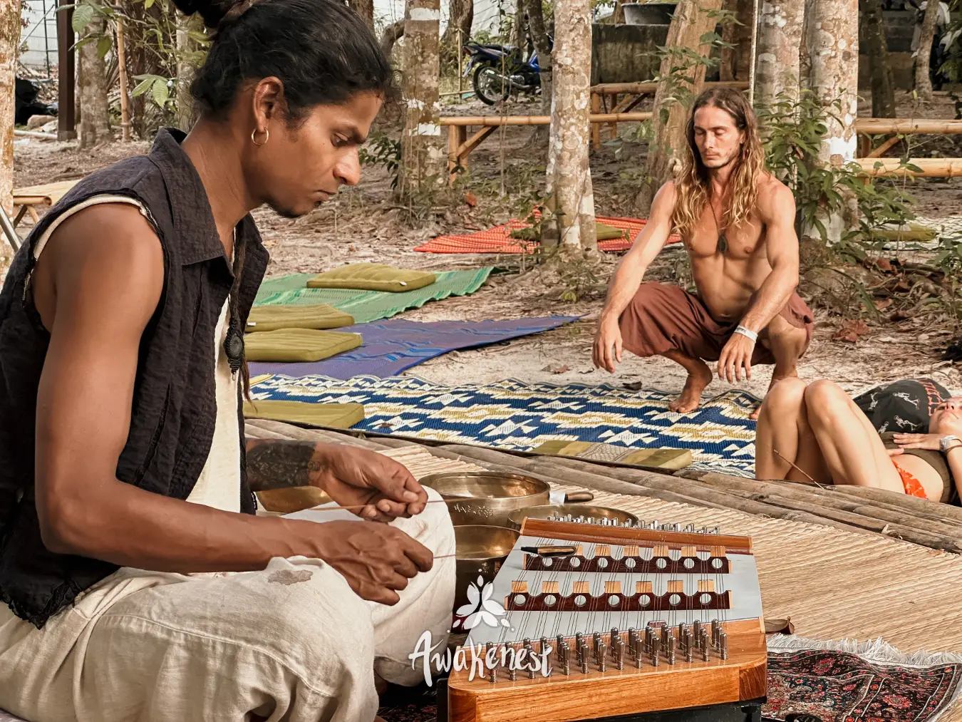 Khim player and man crouching on mats.