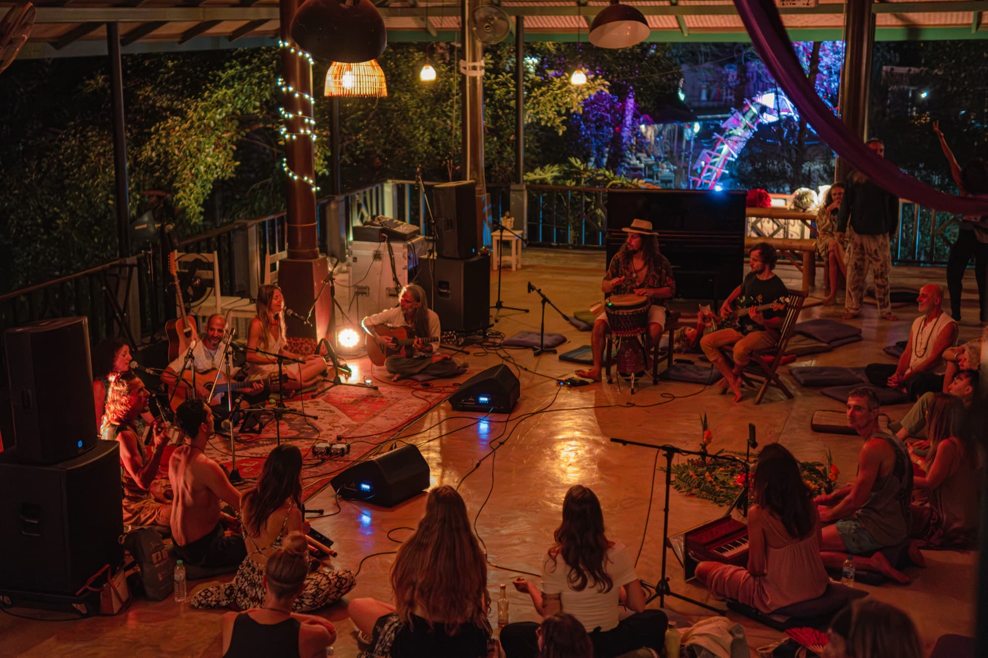Musicians and listeners gathered in a circle in the Music Lounge